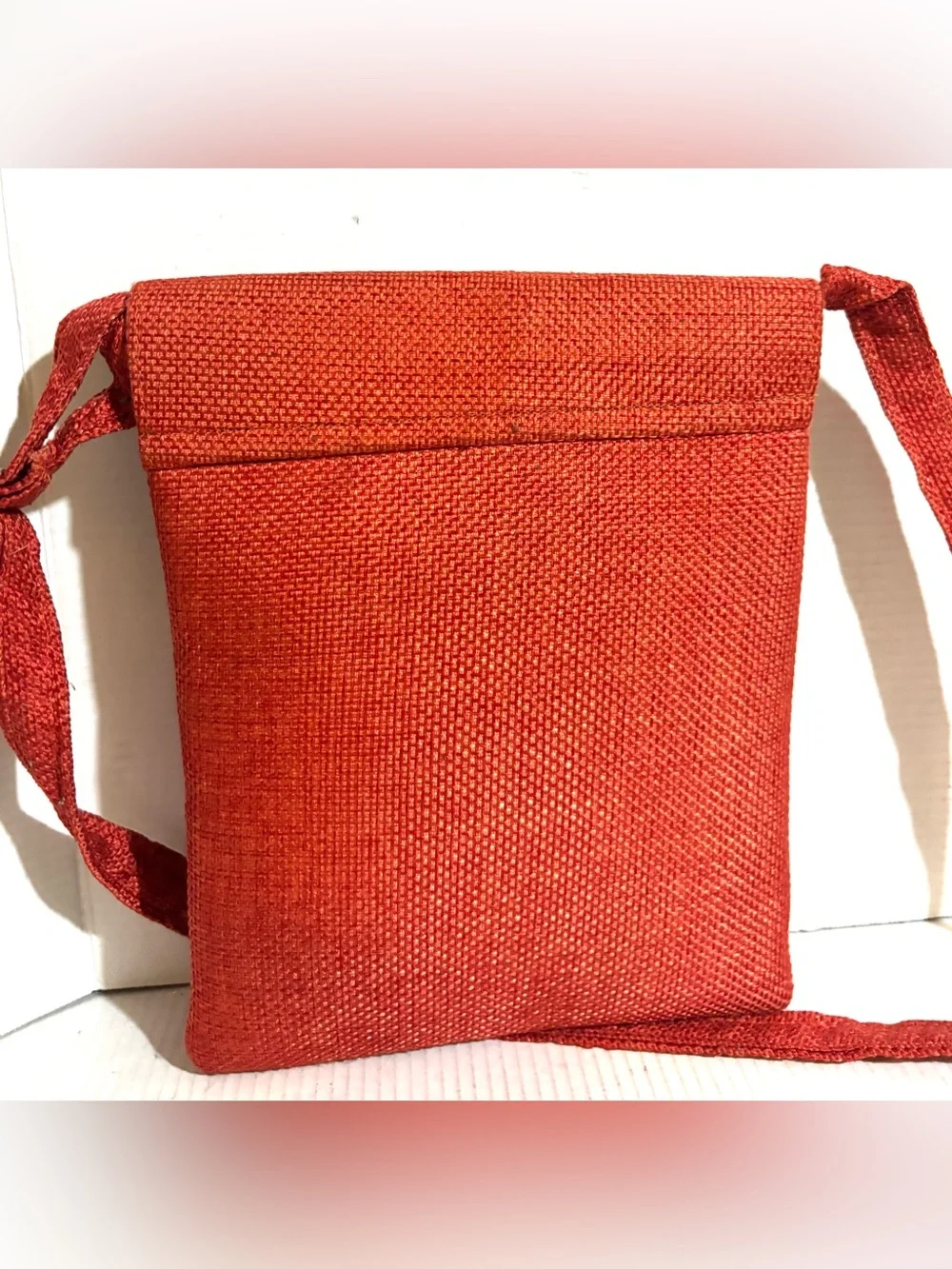 Handwoven Orange Crossbody Bag with Beaded Accent